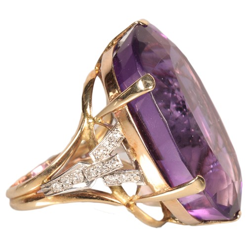 Ladies large amethyst ring set on unmarked yellow metal with diamond shoulders, ring size P.