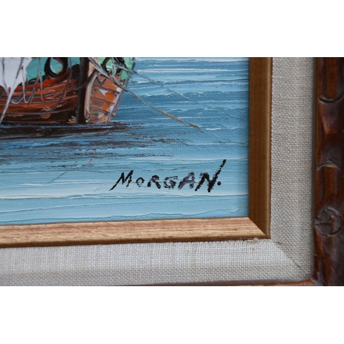 385 - MORGAN, fishing boat moored at pier, oil on canvas, signed lower right, 22cm x 29cm, carved wood fra... 