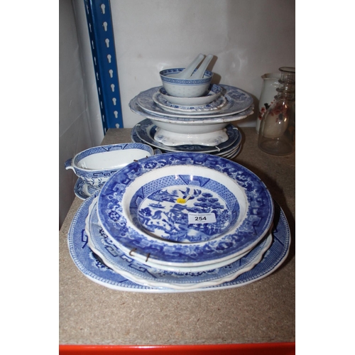 254 - Blue and white ceramics to include serving plates, and wall plates.