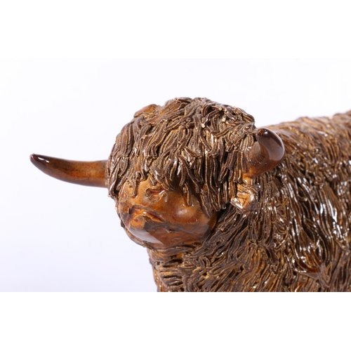 100A - Model of a spaghetti pottery highland cow, inscribed to base, 12cm.