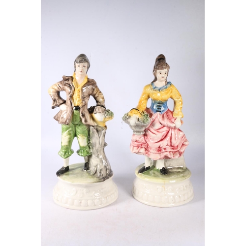 108 - Pair of Capodimonte figures of a man and a woman, 40cm high.