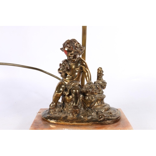 141 - Gilt metal table lamp with a gilt metal figure, mounted on stone base, 36cm high.