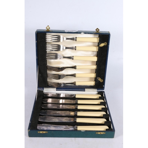 146 - Boxed fish knife and fork set.