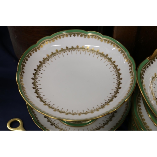 89 - French dessert service, decorated with green and gilt, retailed by Wylie, Hill & Co. of Glasgow.