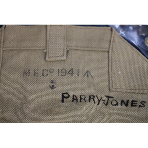 178 - 1941 canvas bag, bearing name Parry-Jones, along with buttons, belts, etc.