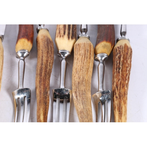 374 - Set of 6 horn handled knives and forks, 