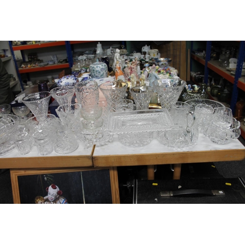 344 - Large collection of glassware to include cut glass vases, bowls, jugs, etc.