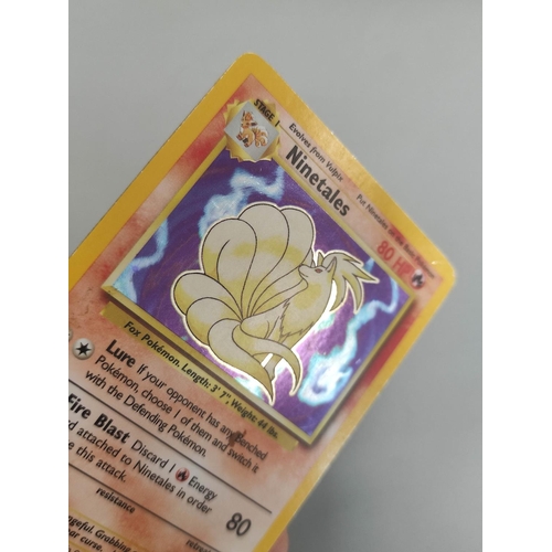 32A - Pokemon Trading Card Game. Folder of cards to include Machamp holo (unlimited) 8/102, Ninetales holo... 