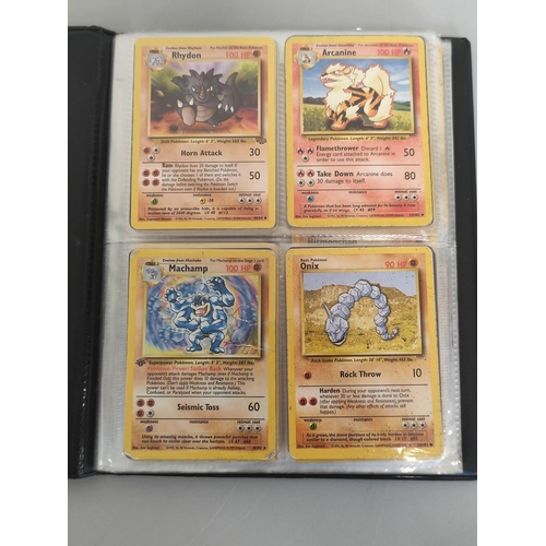 32A - Pokemon Trading Card Game. Folder of cards to include Machamp holo (unlimited) 8/102, Ninetales holo... 