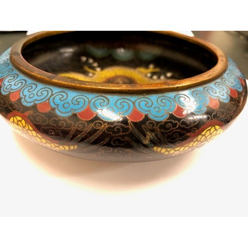 11 - Chinese cloisonné bowl, five claw dragons to sides and well with wooden stand, 14cm diameter.