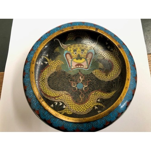 11 - Chinese cloisonné bowl, five claw dragons to sides and well with wooden stand, 14cm diameter.