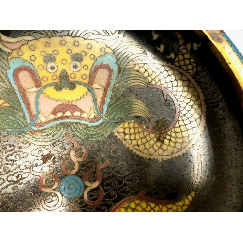 11 - Chinese cloisonné bowl, five claw dragons to sides and well with wooden stand, 14cm diameter.