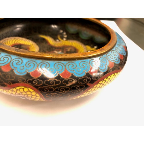 11 - Chinese cloisonné bowl, five claw dragons to sides and well with wooden stand, 14cm diameter.