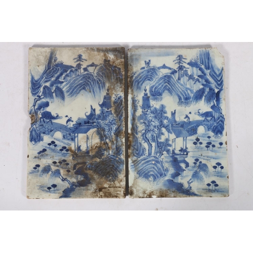 524 - Two 19th century oriental blue and white porcelain tiles, decorated as a mirror image of landscape s... 