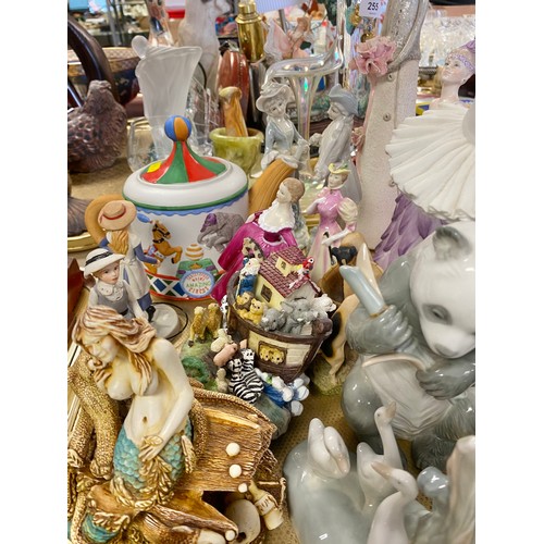 254 - Decorative items to include a circus teapot, a Coalport figurine, other figurines and animal models,... 