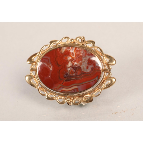 128 - 9ct gold mounted reversible agate brooch.