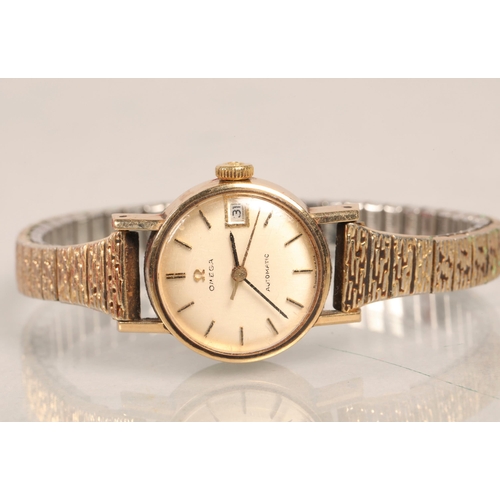 146 - Lady's 9ct gold Omega automatic wristwatch, with expandable strap and original box.