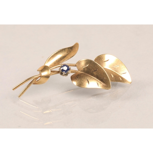 75 - 9ct gold leaf brooch, set with a small sapphire, 3g.