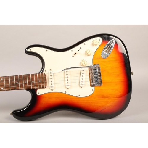 202 - Squier Strat Fender Sunburst, in soft guitar case.