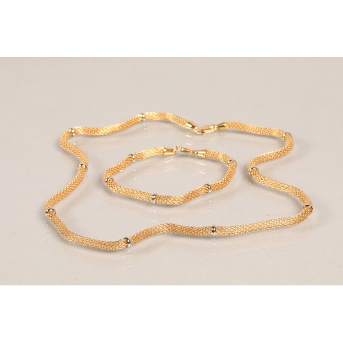 84 - 18ct gold necklace, with matching bracelet, in fitted case, 27.3g.