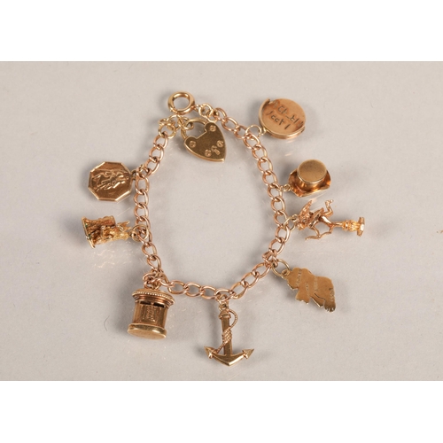 87 - 9ct gold charm bracelet, 16g.