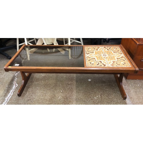 546 - Glass top coffee table with retro tiles, 121 x 50 x 45cm.