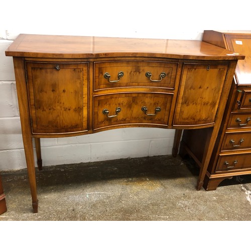 555 - Bevan-Funnell Reprodux yew wood, serpentine fronted, sideboard, 107 x 41 x 81cm.