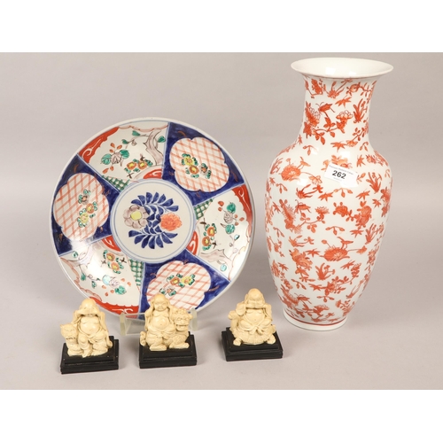 262 - Imari charger, an oriental style floral decorated vase, and three Buddha models.