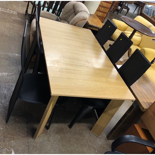 563 - Contemporary extendable dining table and six faux leather chairs.  (7)