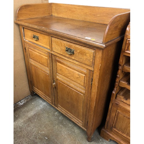 583 - Oak cabinet with two drawers over two cupboard doors, 120cm high.