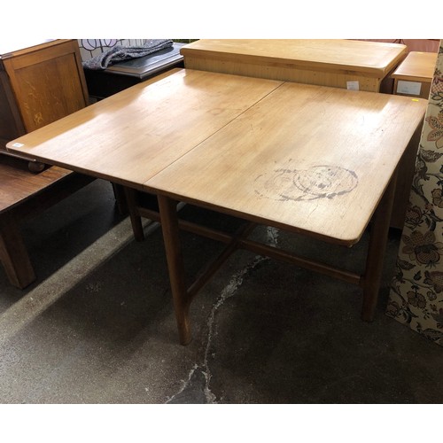 577 - Mid-century teak extendable dining table.