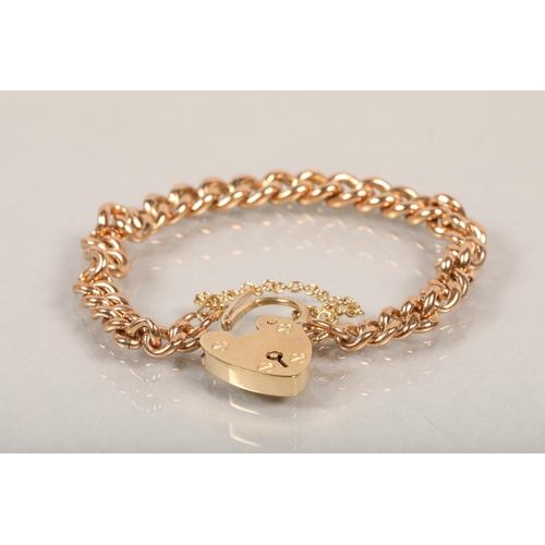 154 - Lady's 9ct gold curb link bracelet, with padlock clasp, 22.7g.