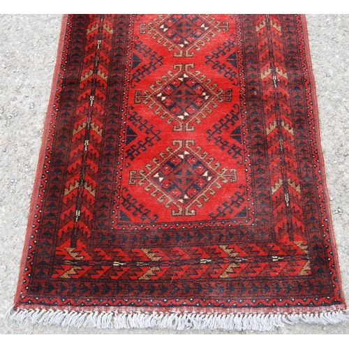 351 - Afghan Khal Mohammadi runner with nine central geometric lozenges and further all over geometric mot... 