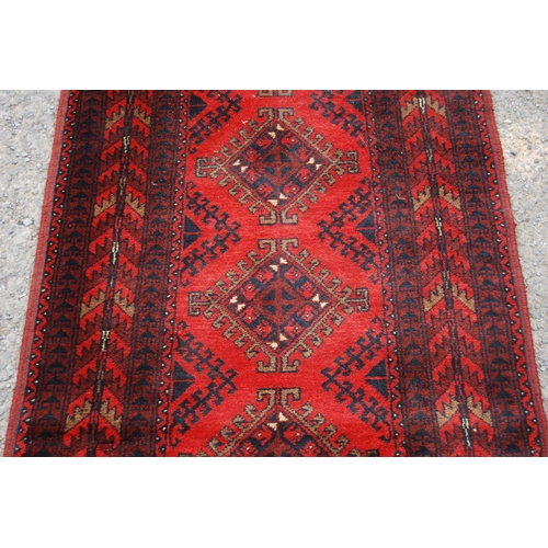 351 - Afghan Khal Mohammadi runner with nine central geometric lozenges and further all over geometric mot... 