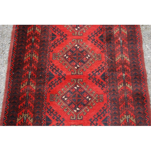 351 - Afghan Khal Mohammadi runner with nine central geometric lozenges and further all over geometric mot... 