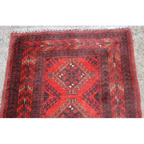 351 - Afghan Khal Mohammadi runner with nine central geometric lozenges and further all over geometric mot... 