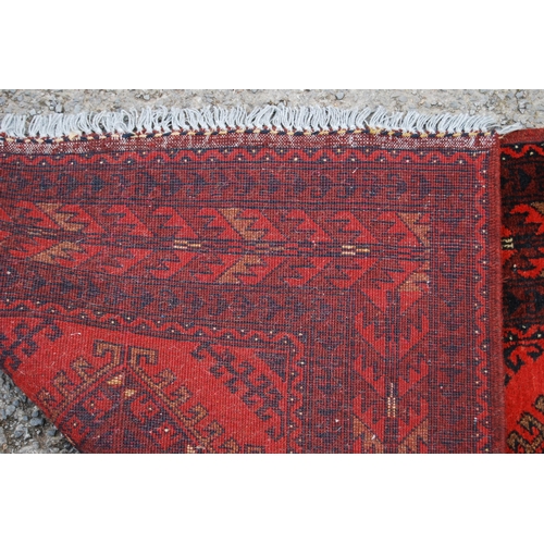 351 - Afghan Khal Mohammadi runner with nine central geometric lozenges and further all over geometric mot... 