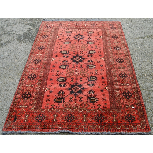 352 - Afghan Khal Mohammadi rug with all over floral and geometric lozenges on blue, cream and red ground,... 