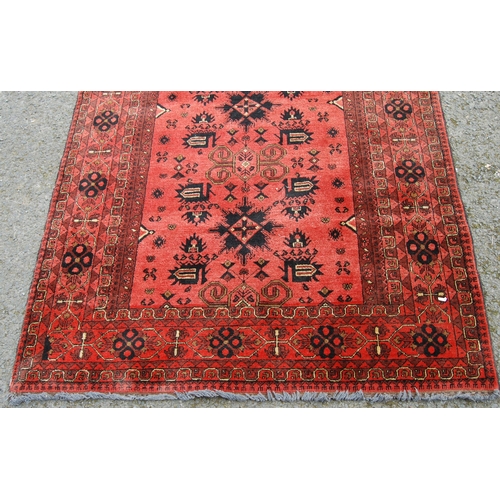 352 - Afghan Khal Mohammadi rug with all over floral and geometric lozenges on blue, cream and red ground,... 