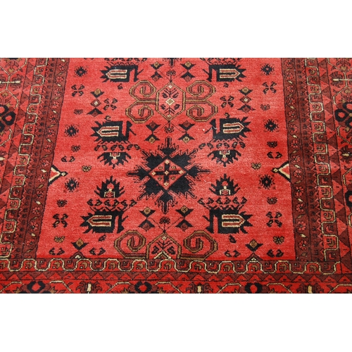 352 - Afghan Khal Mohammadi rug with all over floral and geometric lozenges on blue, cream and red ground,... 