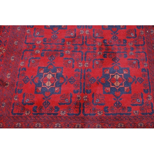 353 - Afghan Khal Mohammadi rug with three rows of two geometric medallions to the centre, all over foliat... 