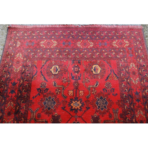 354 - Afghan Khal Mohammadi rug with all over floral and geometric decoration on blue, beige and red groun... 