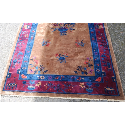 355 - Chinese rug, c. early 20th century, with all over floral panels on beige ground with a blue, wine an... 