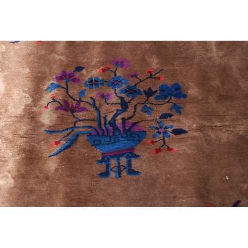 355 - Chinese rug, c. early 20th century, with all over floral panels on beige ground with a blue, wine an... 