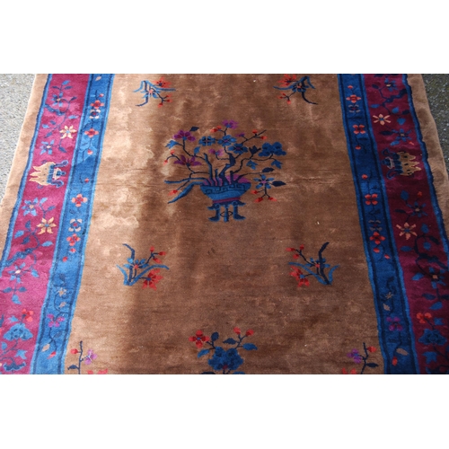 355 - Chinese rug, c. early 20th century, with all over floral panels on beige ground with a blue, wine an... 