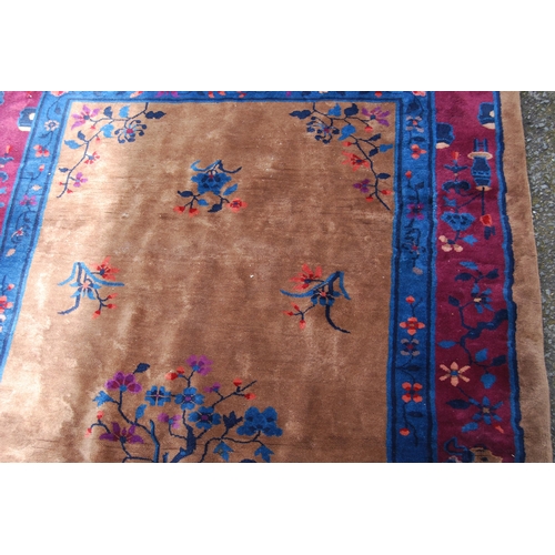 355 - Chinese rug, c. early 20th century, with all over floral panels on beige ground with a blue, wine an... 