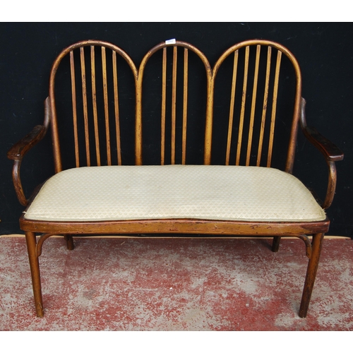 361 - Jacob & Josef (J & J ) Kohn of AustriaBentwood settee with triple wheel frame and stick back... 