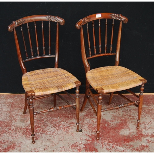 363 - In the Manner of William Morris & Philip WebbPair of Sussex chairs, each with a scroll top rail ... 