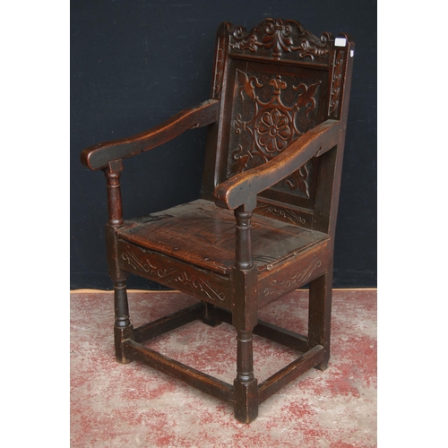 365 - Oak Wainscot chair, c. late 17th/early 18th century, decorated with fleur de lys motifs and a floral... 