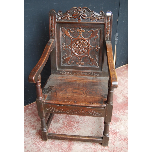 365 - Oak Wainscot chair, c. late 17th/early 18th century, decorated with fleur de lys motifs and a floral... 